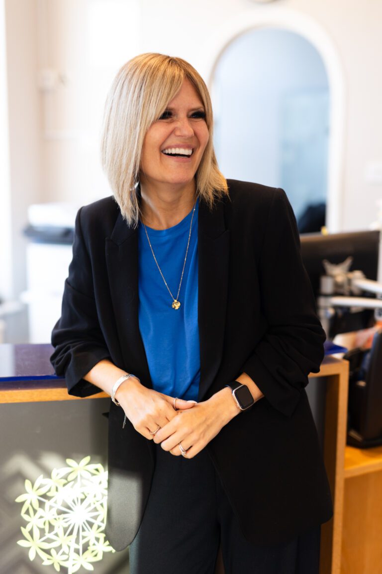 Female blonde receptionist smiling
