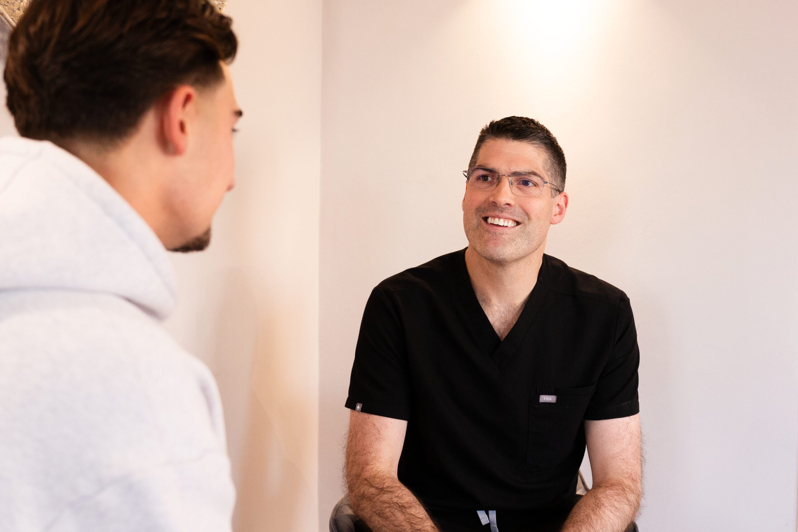Principle Dentist Ben Kemsley smiling at a patient