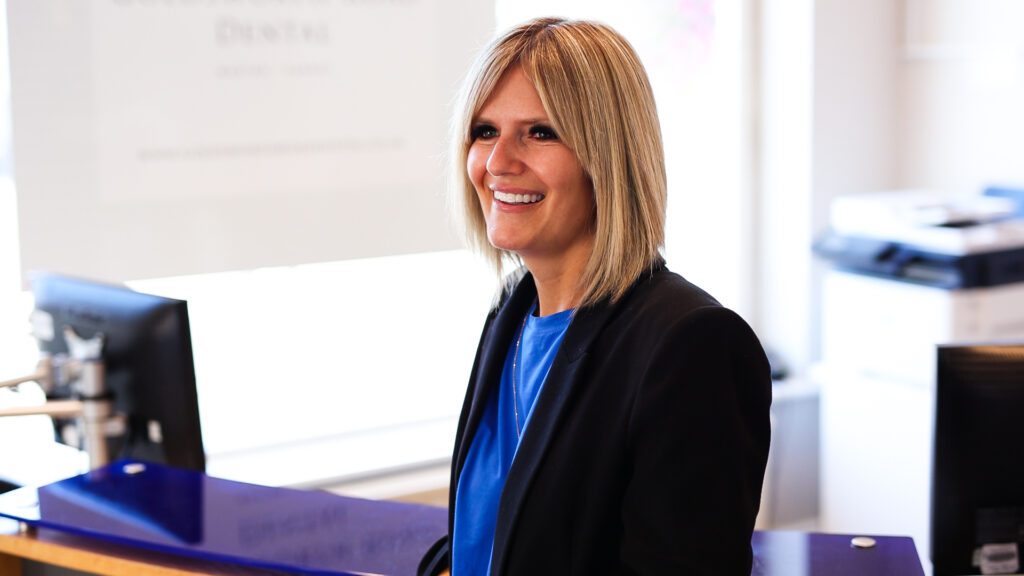 Blonde female receptionist smiling